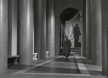Movie still from “Julius Caesar” (1953), directed by Joseph L. Mankiewicz – A man walking through an archway in a building; Wide shot, Low angle