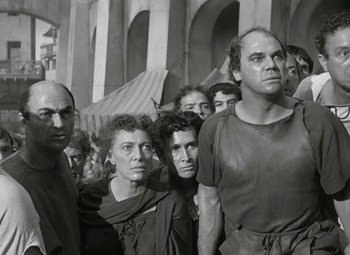 Movie still from “Julius Caesar” (1953), directed by Joseph L. Mankiewicz – A black and white photo of a group of people; Medium shot, Low angle