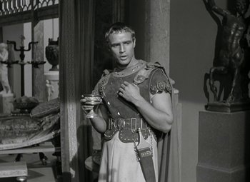 Movie still from “Julius Caesar” (1953), directed by Joseph L. Mankiewicz – Black and white photograph of a man in roman garb; Medium shot, Over the shoulder angle