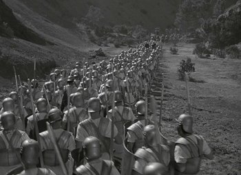 Movie still from “Julius Caesar” (1953), directed by Joseph L. Mankiewicz – A black - and - white photo of a line of roman legionnaires; Extreme Wide shot, High angle