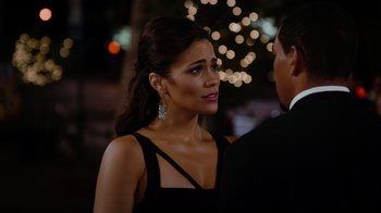 Movie still from “Jumping the Broom” (2011), directed by Salim Akil – A woman in a black dress standing next to a man in a black suit; Close Up shot, Over the shoulder angle