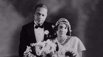 Movie still from “Jumping the Broom” (2011), directed by Salim Akil – An old photo of a man and woman posing for a wedding picture; Close Up shot, High angle