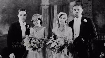 Movie still from “Jumping the Broom” (2011), directed by Salim Akil – A black and white photo of a group of people holding bouquets of flowers; Medium shot, High angle