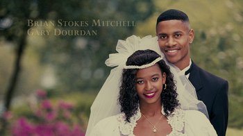 Movie still from “Jumping the Broom” (2011), directed by Salim Akil – A man and a woman posing for a wedding picture; Close Up shot, High angle