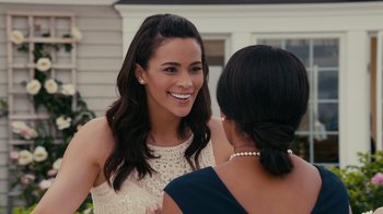 Movie still from “Jumping the Broom” (2011), directed by Salim Akil – Two women are talking and smiling at each other; Close Up shot, Over the shoulder angle