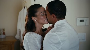 Movie still from “Jumping the Broom” (2011), directed by Salim Akil – A man and a woman kissing in a room; Close Up shot, Over the shoulder angle