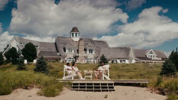 Movie still from “Jumping the Broom” (2011), directed by Salim Akil – Two people sitting on a bench in front of a house; Extreme Wide shot, High angle