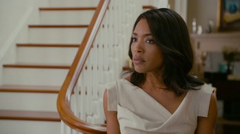 Movie still from “Jumping the Broom” (2011), directed by Salim Akil – A woman sitting on top of a wooden stair case; Medium shot, Over the shoulder angle