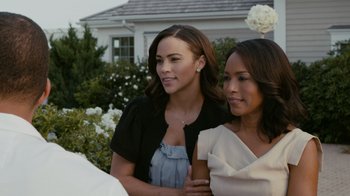 Movie still from “Jumping the Broom” (2011), directed by Salim Akil – Two women standing next to each other in front of a house; Close Up shot, Over the shoulder angle