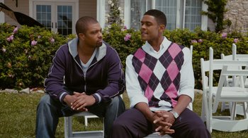 Movie still from “Jumping the Broom” (2011), directed by Salim Akil – Two young men sitting in front of a house; Medium shot, Over the shoulder angle