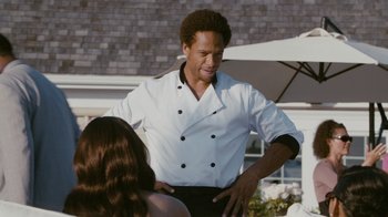 Movie still from “Jumping the Broom” (2011), directed by Salim Akil – A man in a chef's outfit standing next to a woman; Medium shot, Over the shoulder angle