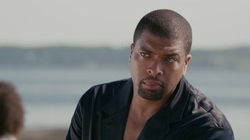Movie still from “Jumping the Broom” (2011), directed by Salim Akil – A person wearing a black shirt; Close Up shot, Over the shoulder angle