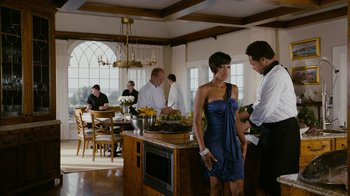 Movie still from “Jumping the Broom” (2011), directed by Salim Akil – A woman in a blue dress standing next to a man in a white shirt; Medium shot, Over the shoulder angle