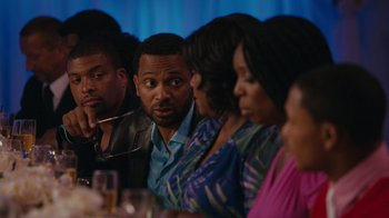 Movie still from “Jumping the Broom” (2011), directed by Salim Akil – A group of people sitting around a table; Medium shot, Over the shoulder angle