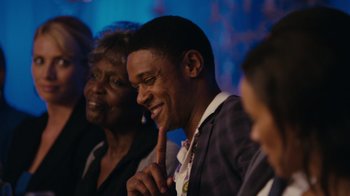 Movie still from “Jumping the Broom” (2011), directed by Salim Akil – A group of people sitting next to each other in a room; Close Up shot, Over the shoulder angle