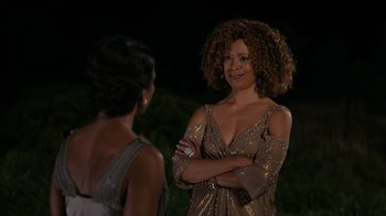 Movie still from “Jumping the Broom” (2011), directed by Salim Akil – Two women standing next to each other at a party; Medium shot, Over the shoulder angle