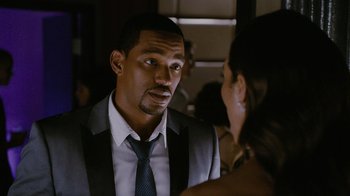 Movie still from “Jumping the Broom” (2011), directed by Salim Akil – A person wearing a suit and a tie; Close Up shot, Over the shoulder angle