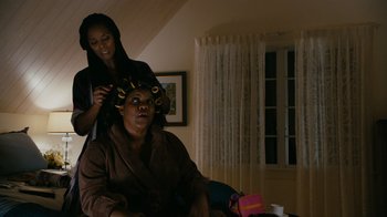 Movie still from “Jumping the Broom” (2011), directed by Salim Akil – A woman is getting her hair done by another woman; Medium shot, Over the shoulder angle