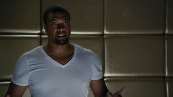 Movie still from “Jumping the Broom” (2011), directed by Salim Akil – A man in a white t - shirt talking to the camera; Medium shot, Over the shoulder angle