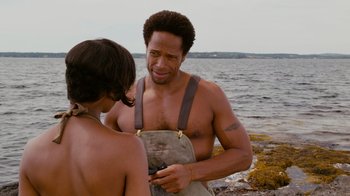 Movie still from “Jumping the Broom” (2011), directed by Salim Akil – A man standing next to a woman on the beach; Medium shot, Over the shoulder angle