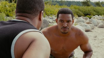 Movie still from “Jumping the Broom” (2011), directed by Salim Akil – A man with no shirt is looking at another man with no shirt; Medium shot, Over the shoulder angle