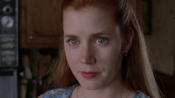 Movie still from “Junebug” (2005), directed by Phil Morrison – A woman's face with blue eyes; Close Up shot, Over the shoulder angle