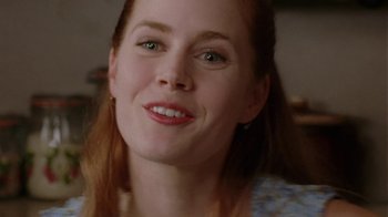 Movie still from “Junebug” (2005), directed by Phil Morrison – A woman's face with green eyes; Close Up shot, Over the shoulder angle