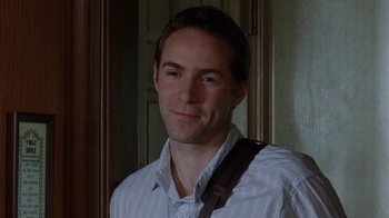 Movie still from “Junebug” (2005), directed by Phil Morrison – A person wearing a white shirt; Close Up shot, Over the shoulder angle