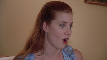 Movie still from “Junebug” (2005), directed by Phil Morrison – A person with long red hair; Close Up shot, Over the shoulder angle