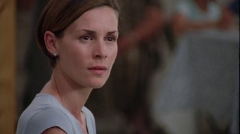 Movie still from “Junebug” (2005), directed by Phil Morrison – A person wearing a blue shirt; Close Up shot, Over the shoulder angle