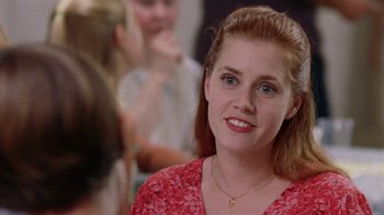 Movie still from “Junebug” (2005), directed by Phil Morrison – A person wearing a red shirt; Close Up shot, Over the shoulder angle