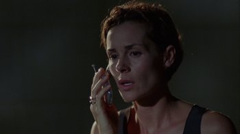 Movie still from “Junebug” (2005), directed by Phil Morrison – A person talking on a cell phone; Close Up shot, Low angle