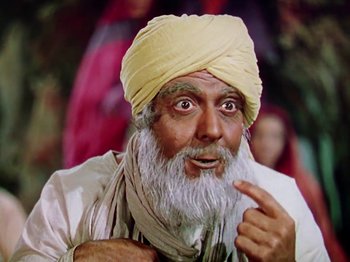 Movie still from “The Jungle Book” (1942), directed by Zoltan Korda – An old man with a beard wearing a yellow turban; Close Up shot, High angle