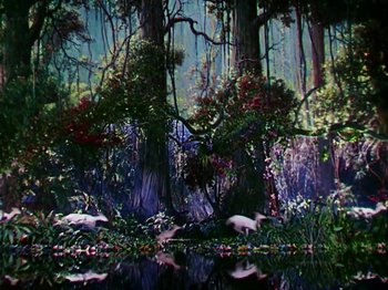 Movie still from “The Jungle Book” (1942), directed by Zoltan Korda – A painting of trees and flowers in a forest; Extreme Wide shot, High angle