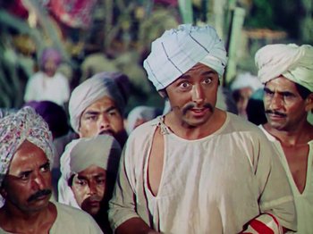 Movie still from “The Jungle Book” (1942), directed by Zoltan Korda – A group of men standing next to each other; Medium shot, Low angle