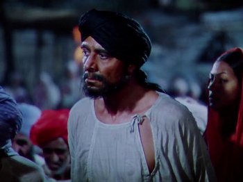 Movie still from “The Jungle Book” (1942), directed by Zoltan Korda – A man with a beard wearing a turban; Medium shot, Low angle