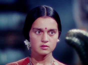 Movie still from “The Jungle Book” (1942), directed by Zoltan Korda – A young woman with a nose ring looking at the camera; Close Up shot, High angle