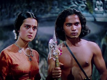 Movie still from “The Jungle Book” (1942), directed by Zoltan Korda – A man and a woman standing next to each other; Medium shot, Low angle