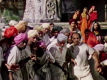 Movie still from “The Jungle Book” (1942), directed by Zoltan Korda – A group of men standing next to each other; Wide shot, High angle