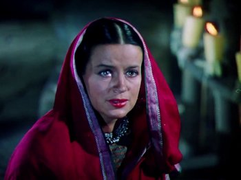 Movie still from “The Jungle Book” (1942), directed by Zoltan Korda – A person wearing a hood; Close Up shot, High angle