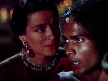 Movie still from “The Jungle Book” (1942), directed by Zoltan Korda – A man and a woman looking at each other; Close Up shot, High angle