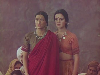 Movie still from “The Jungle Book” (1942), directed by Zoltan Korda – Two women in traditional indian garb posing for a picture; Medium shot, Low angle