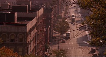 Movie still from “Jungle Fever” (1991), directed by Spike Lee – An aerial view of a city street with fire escapes; Extreme Wide shot, High angle