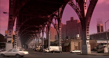 Movie still from “Jungle Fever” (1991), directed by Spike Lee – A view of a city from under an overpass; Extreme Wide shot, Low angle