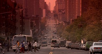 Movie still from “Jungle Fever” (1991), directed by Spike Lee – A city street filled with lots of traffic; Extreme Wide shot, High angle