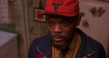 Movie still from “Jungle Fever” (1991), directed by Spike Lee – A person wearing a hat; Close Up shot, High angle