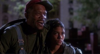 Movie still from “Jungle Fever” (1991), directed by Spike Lee – A man and a woman standing next to each other; Close Up shot, Low angle