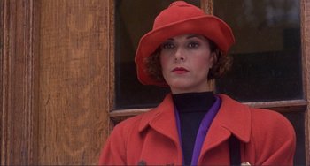 Movie still from “Jungle Fever” (1991), directed by Spike Lee – A woman wearing a red hat and a red coat; Close Up shot, High angle