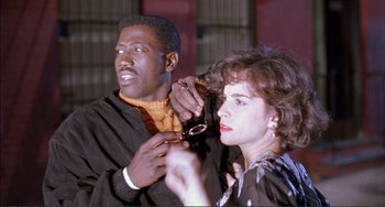 Movie still from “Jungle Fever” (1991), directed by Spike Lee – A man and a woman are looking at each other; Close Up shot, Low angle
