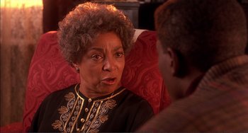Movie still from “Jungle Fever” (1991), directed by Spike Lee – An older woman talking to a younger man; Close Up shot, Over the shoulder angle